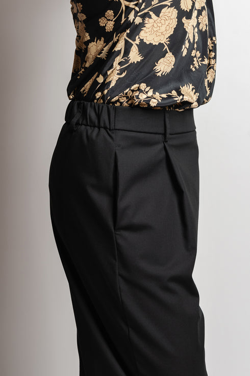 Pantaloni asimmetrici a pieghe Margret